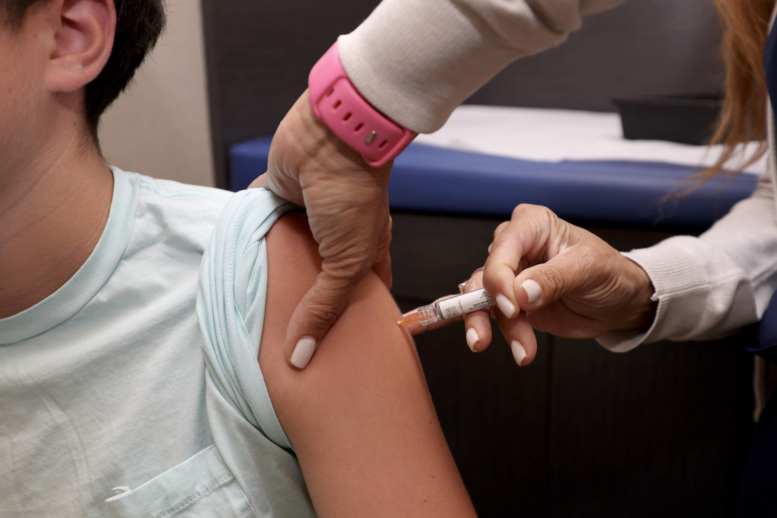 A child receives a standard immunization on Sept. 15, 2025, in Coral Gables, Florida. (Joe Raedle/Getty Images)