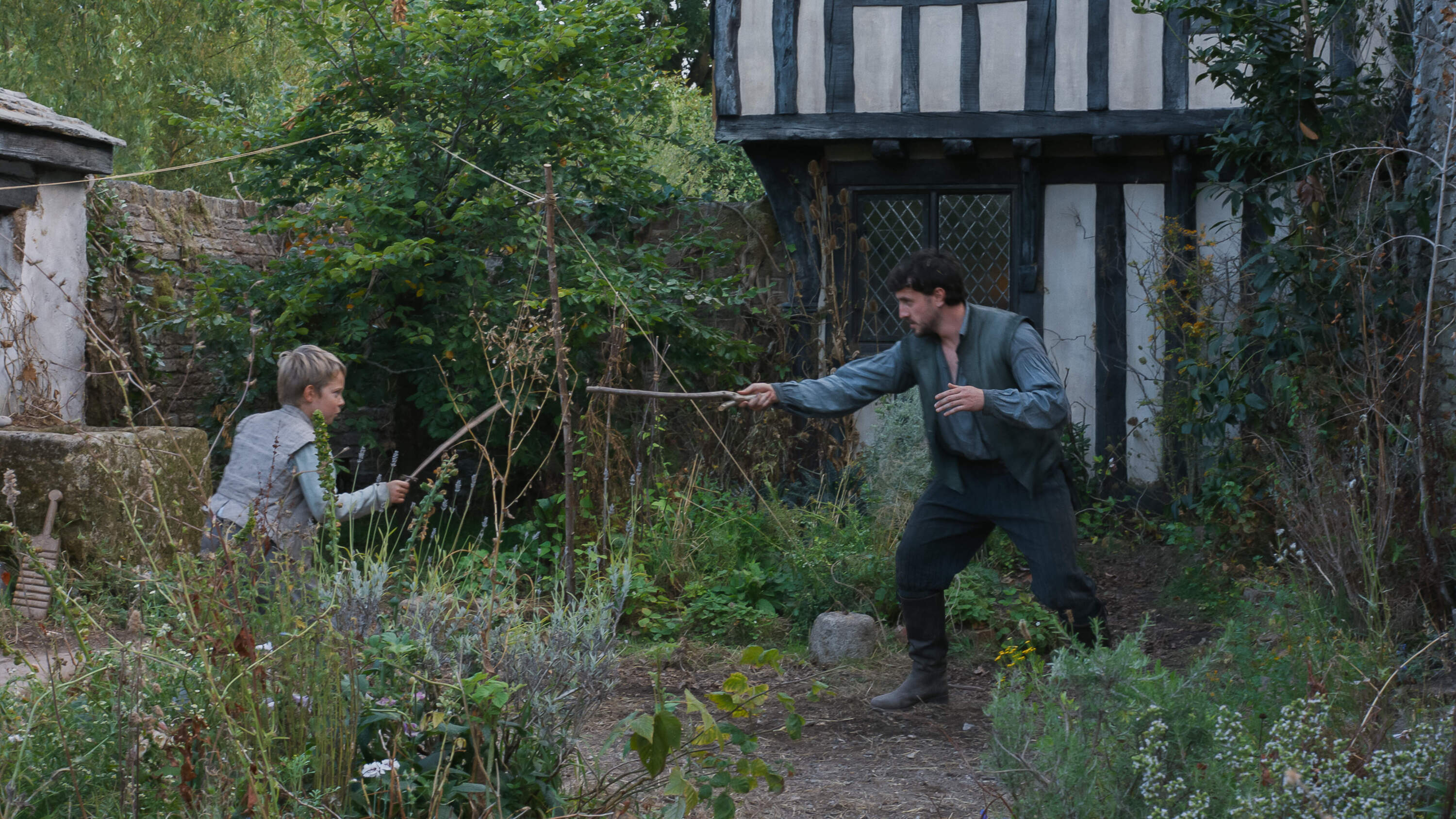 Jacobi Jupe as Hamnet and Paul Mescal as William Shakespeare in director Chloé Zhao’s "Hamnet." (Courtesy Agata Grzybowska/Focus Features)