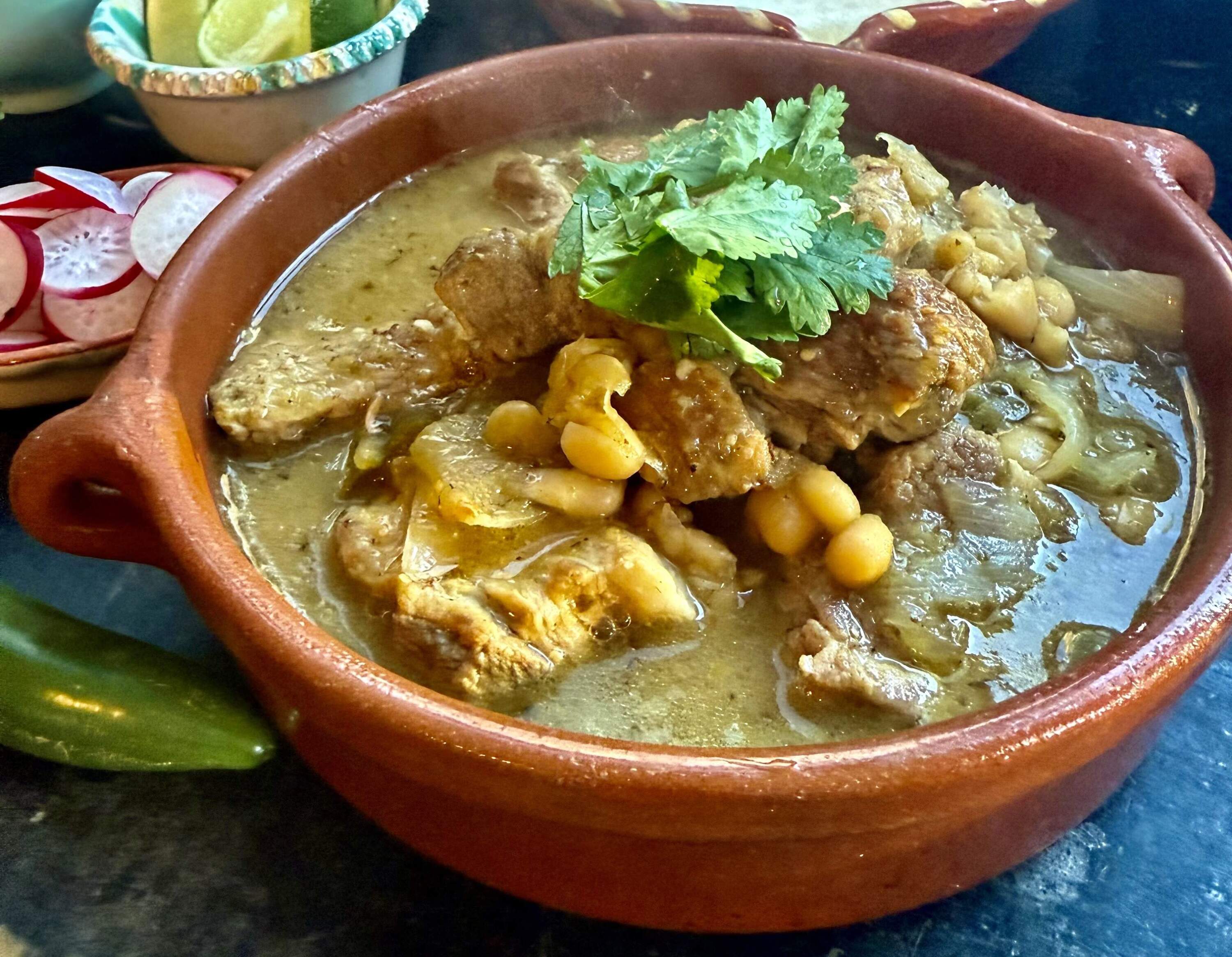 Pork stew with white beans, chilis and salsa verde. (Kathy Gunst/Here & Now)
