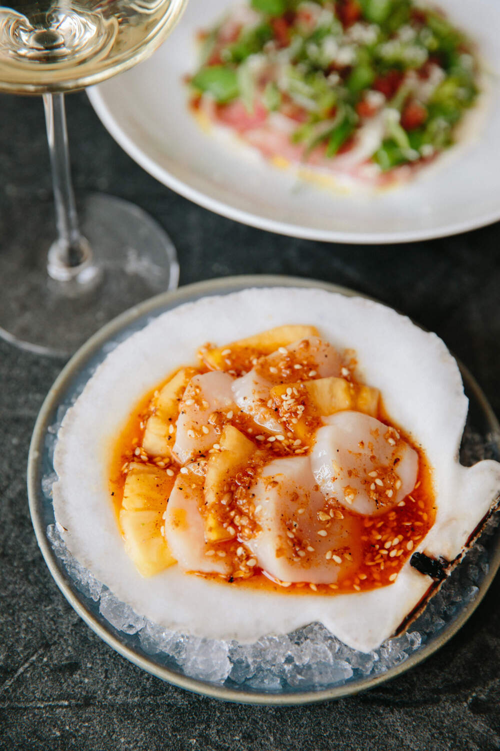 Scallop crudo with pineapple, guajillo chili, and sesame from Mooncusser. (Brian Samuels Photography/Mooncusser)