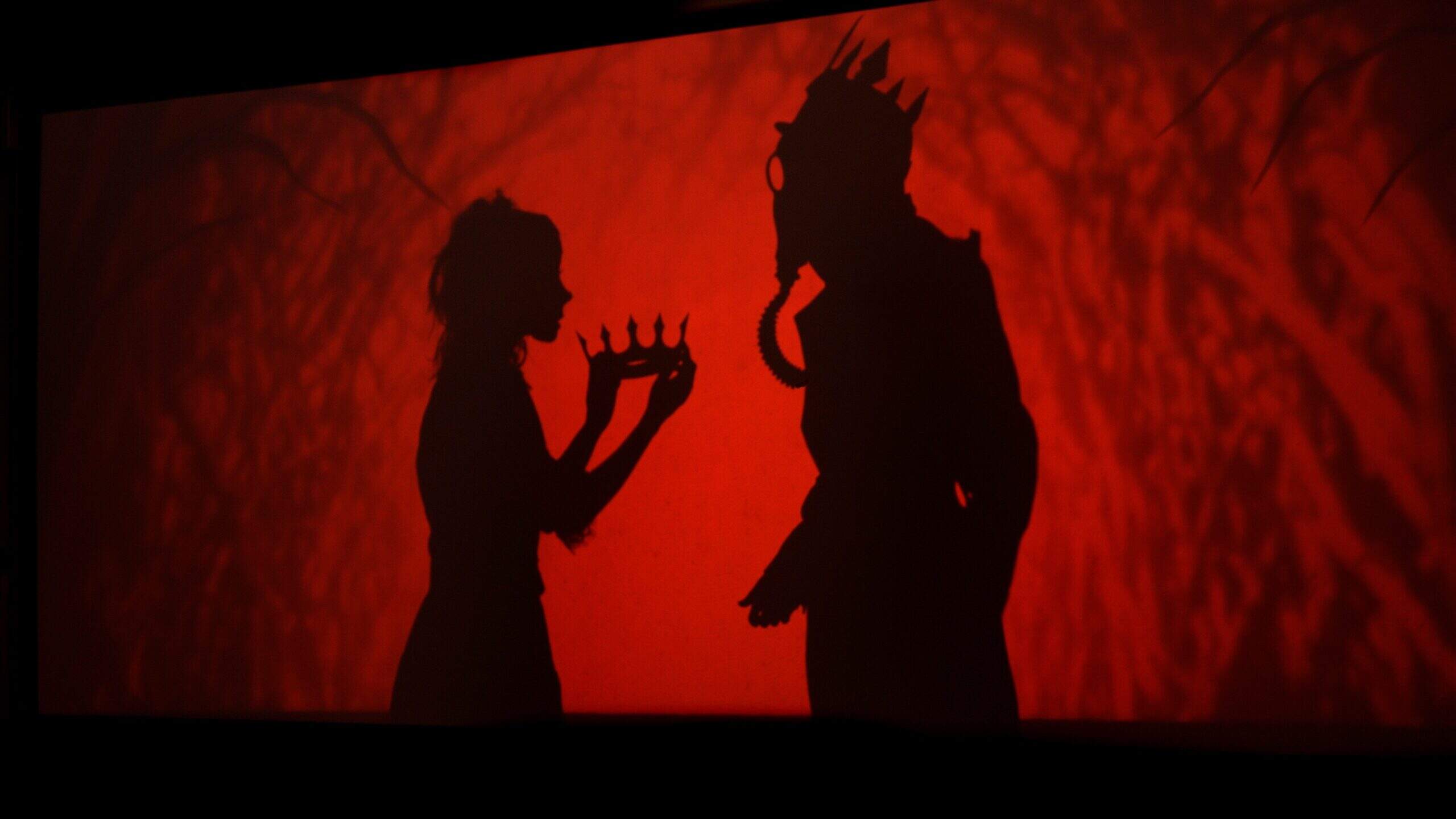 From left, Sarah Fornace and Jeffrey Paschal in Manual Cinema's "The 4th Witch." (Courtesy Katie Doyle)