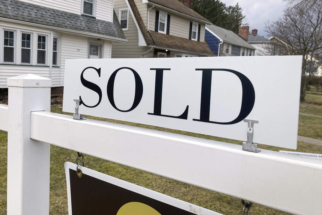 FILE - A sold sign hangs in front of a Brighton, New York house on Tuesday, February 21, 2023. The average rate on a 30-year mortgage rose to 6.66% from 6.62% last week, mortgage buyer Freddie Mac said Thursday, Jan. 11, 2024. (AP Photo/Ted Shaffrey, File)