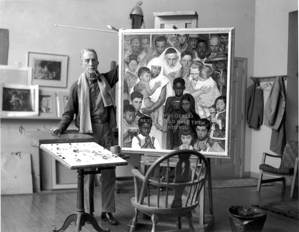 Norman Rockwell with "Golden Rule" painting. c1961. Photo by Louie Lamone. Norman Rockwell Museum Collection. Licensed by Norman Rockwell Family Agency. All Rights Reserved.