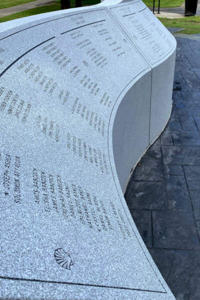 The names of Revolutionary War veterans from Mashpee are carved into the granite face of the veterans memorial. (Courtesy of Richard DeSorgher)