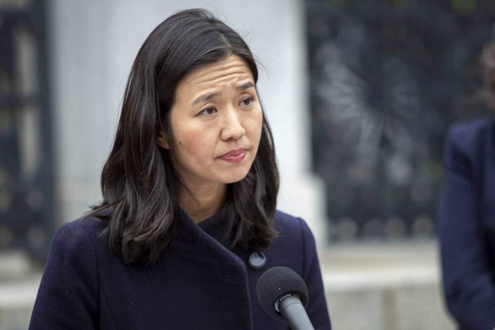 Mayor Michelle Wu speaks to reporters on the steps of the Massachusetts State House in 2022. (Robin Lubbock/WBUR)