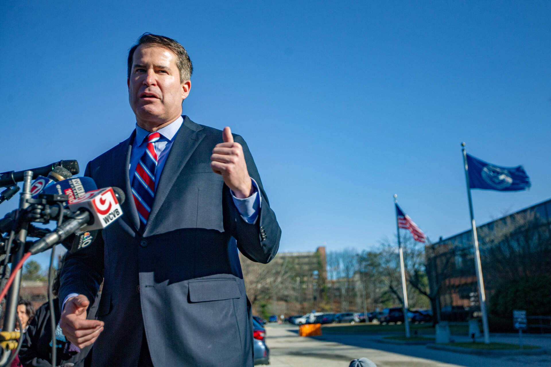 Congressman Seth Moulton speaks to the news media and describes what he witnessed during his visit at to the ICE Boston Field Office in Burlington. (Jesse Costa/WBUR)