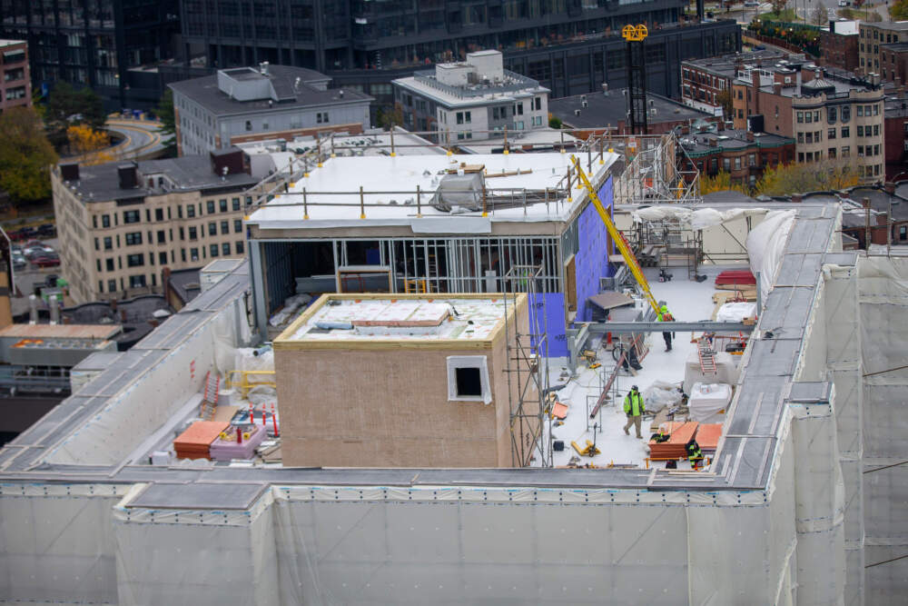 Roofing work being done on Tower A of Warren Towers. (Jesse Costa/WBUR)
