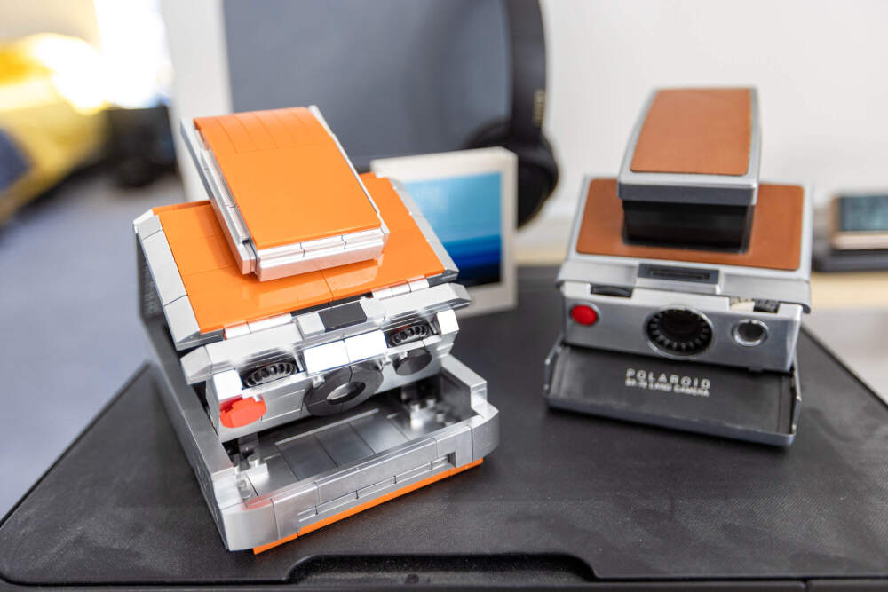 Sam Aquillano's Lego replica of a Polaroid Land Camera in his home office. (Jesse Costa/WBUR)