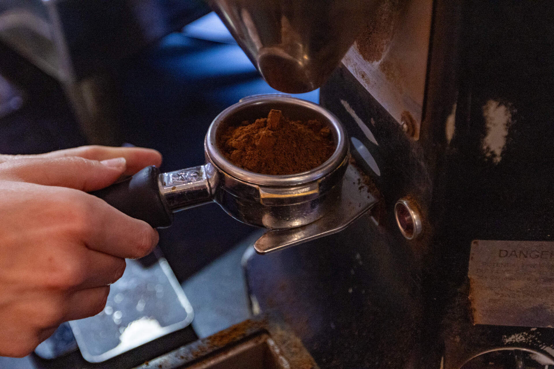 Ground coffee being prepared to make espresso at the 1369 Coffeehouse in Inman Square. (Jesse Costa/WBUR)