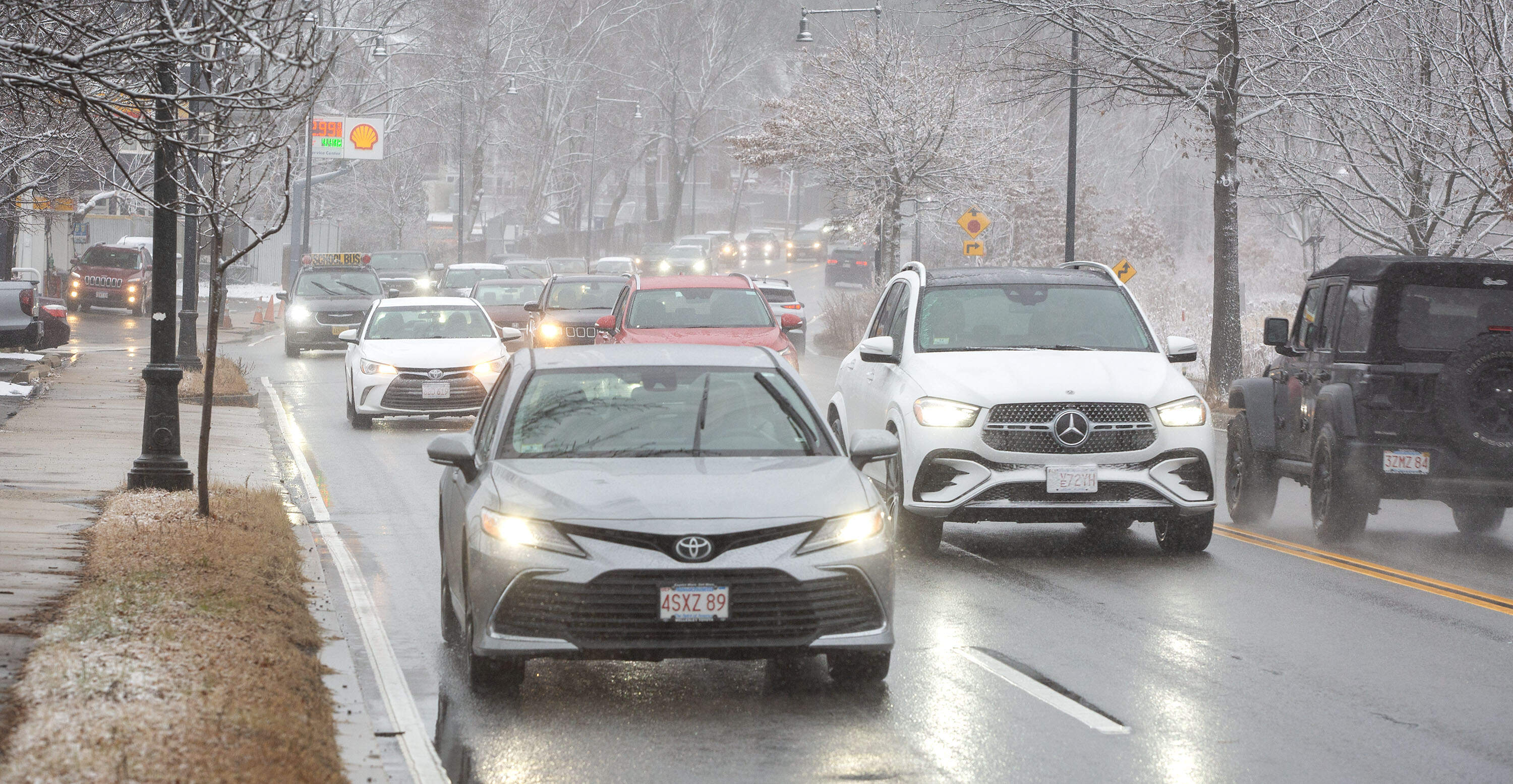 Dense traffic makes its way along a snowy Fresh Pond Parkway in Cambridge, Mass. (Robin Lubbock/WBUR)