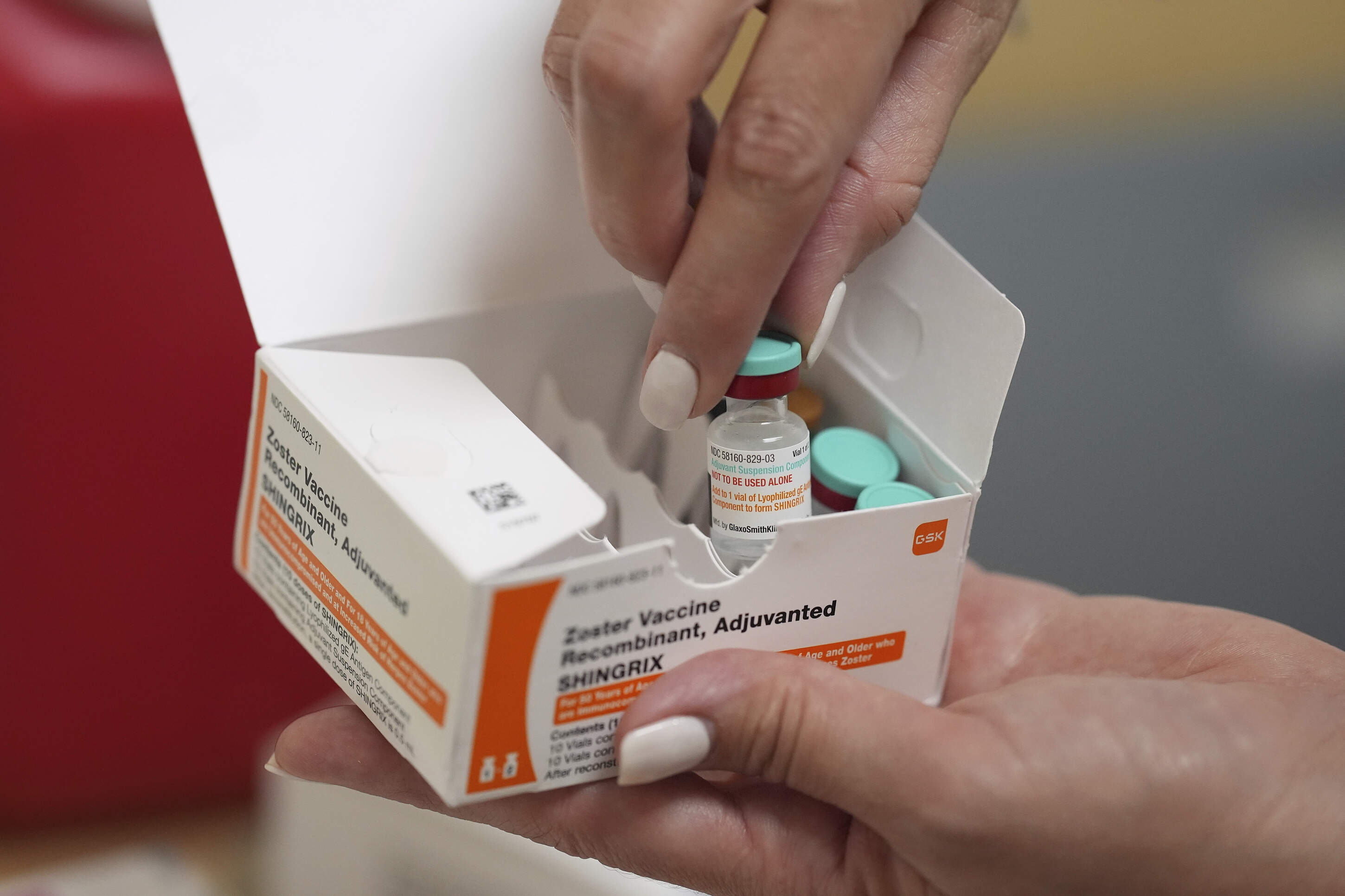 A pharmacist displays doses of a vaccine that protects against shingles, at a CVS Pharmacy, Tuesday, Sept. 9, 2025, in Miami. (Rebecca Blackwell/AP)