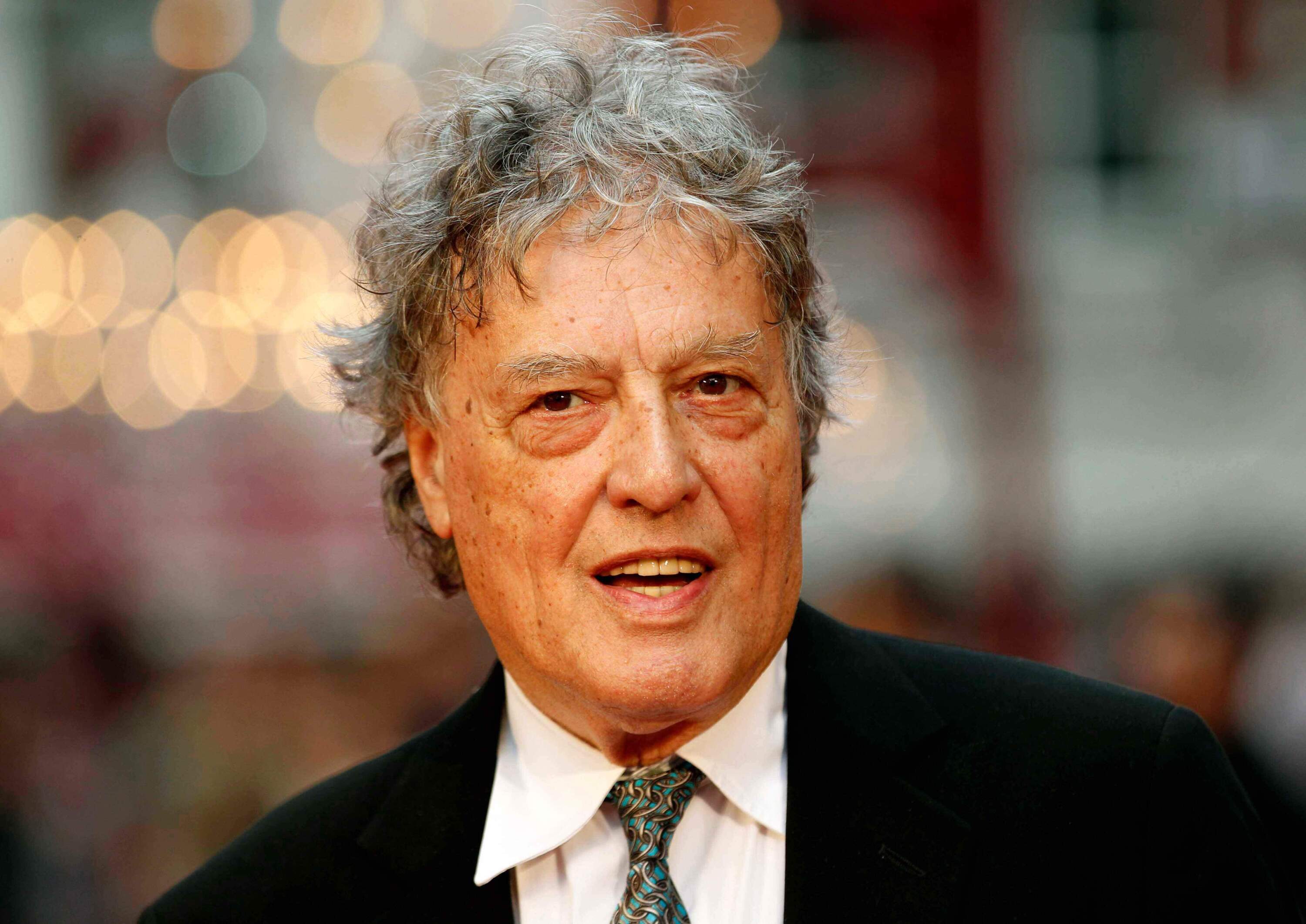 In this Sept. 4, 2012 file photo, British playwright Tom Stoppard poses as he arrives for the world premiere of "Anna Karenina," in London. (Sang Tan, File/AP)