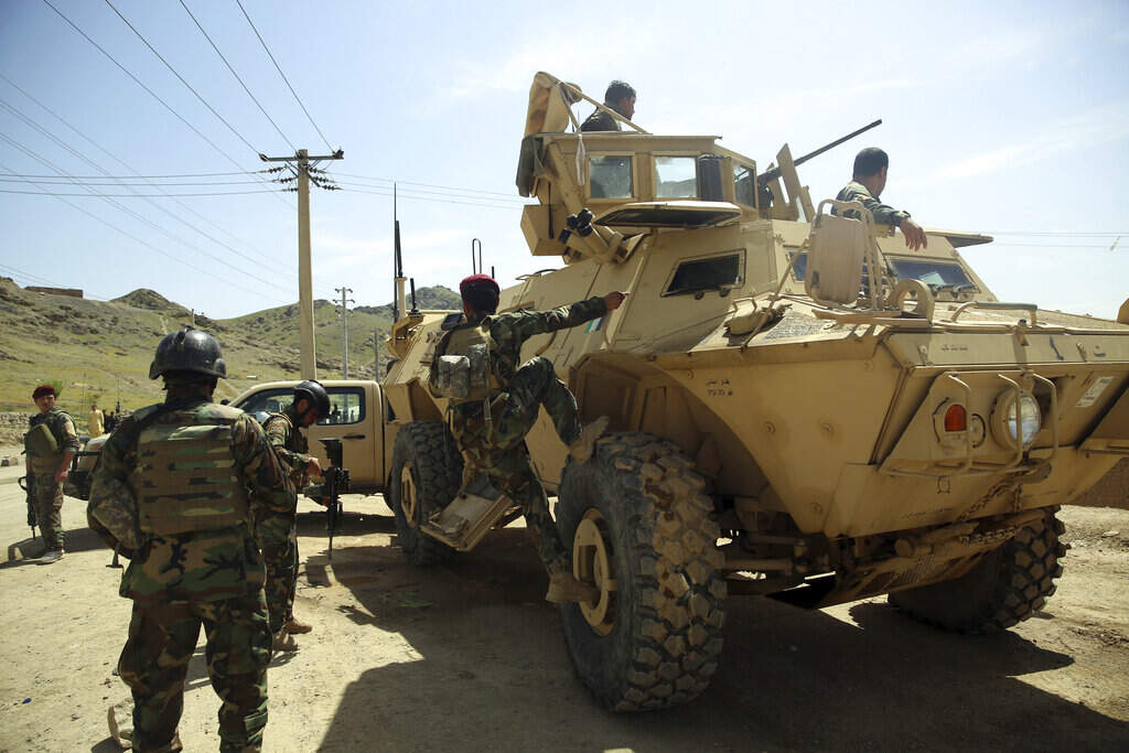 In this Wednesday, April 29, 2020 file photo, Afghan special forces stand guard at the site of a suicide bomber attack on the outskirts of Kabul, Afghanistan. The U.S. mission in Afghanistan has for the first time refused to publicly release its data on insurgent attacks amid the implementation of a peace agreement between the U.S. and Taliban, a U.S. watchdog said Friday, May 1, 2020. Washington’s Special Inspector General for Afghanistan Reconstruction, which monitors billions of dollars in U.S. aid to Afghanistan, expressed its concern in its quarterly report, which also discusses the reduction in ground operations of Afghan forces. (AP Photo/Rahmat Gul, File)