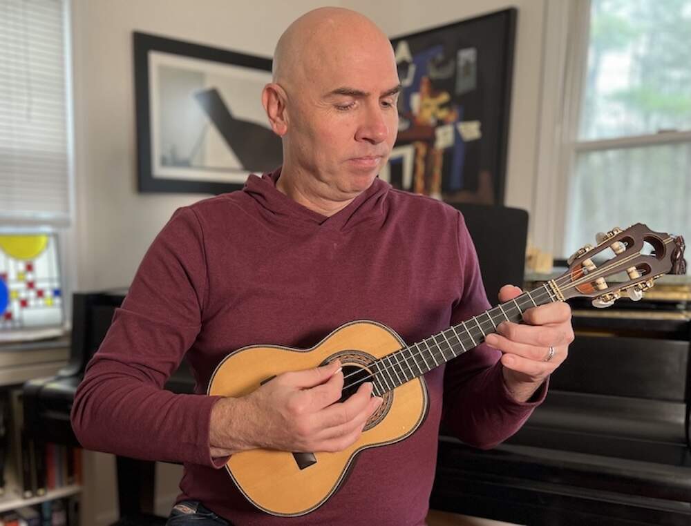 Eric Shimelonis plays the cavaquinho: a small classical guitar originally from Portugal. (image courtesy of Rebecca Sheir)