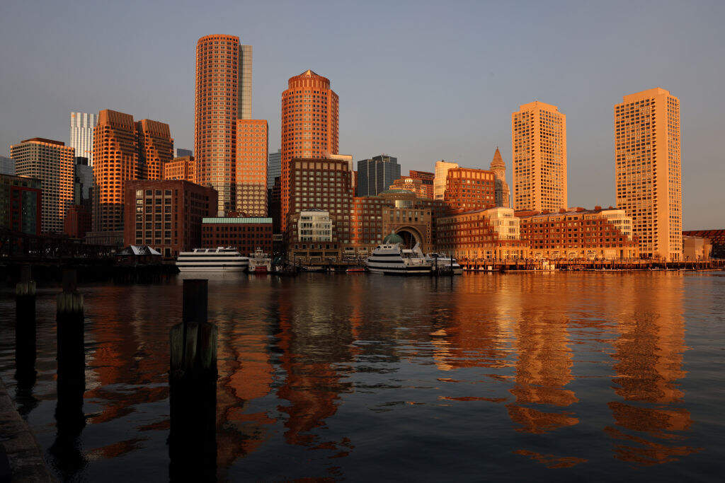 Boston skyline at sunrise, viewed from Fan Pier Park. (Craig F. Walker/The Boston Globe via Getty Images)