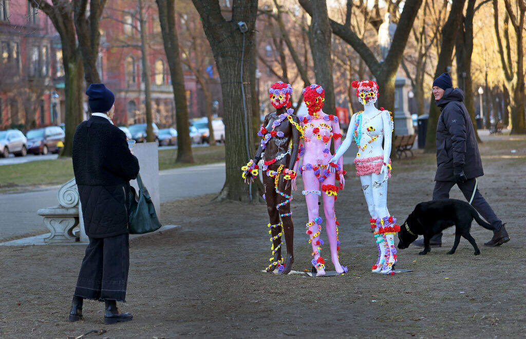 Some sculptures/mannequins on Commonwealth Avenue in Boston got the attention walkers by. (David L. Ryan/The Boston Globe via Getty Images)