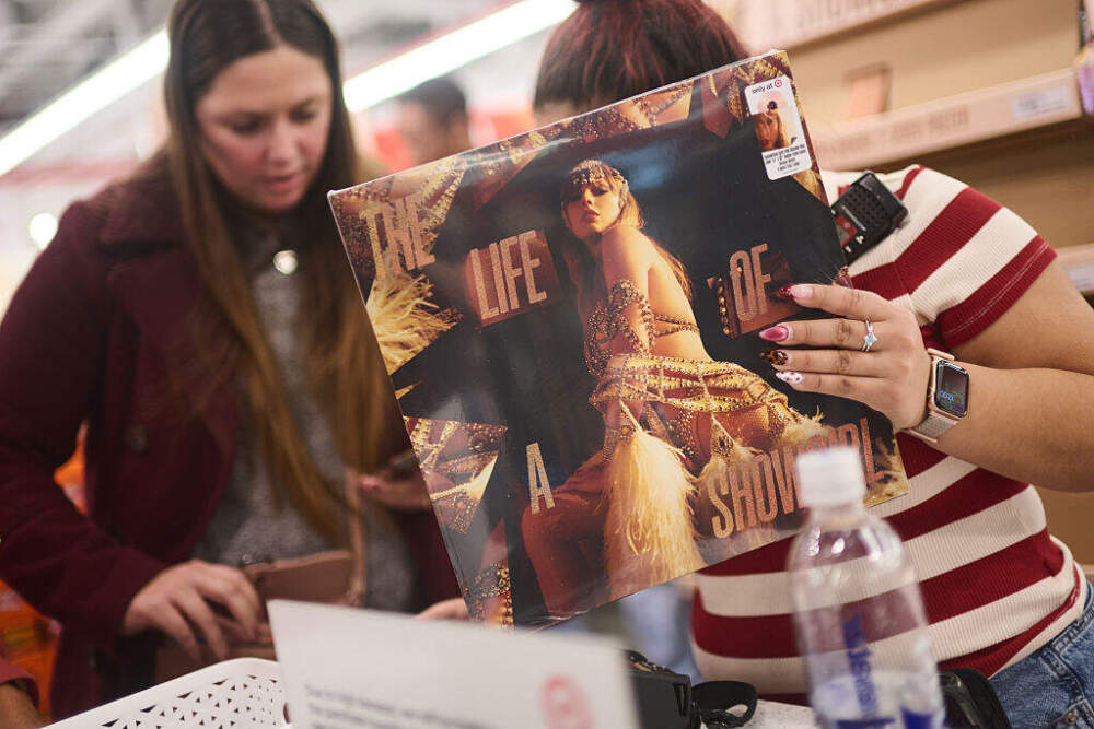 Fans look at Taylor Swift's album, "The Life of a Showgirl," at Target on October 3 in New York City. (Valerie Terranova/Getty Images)