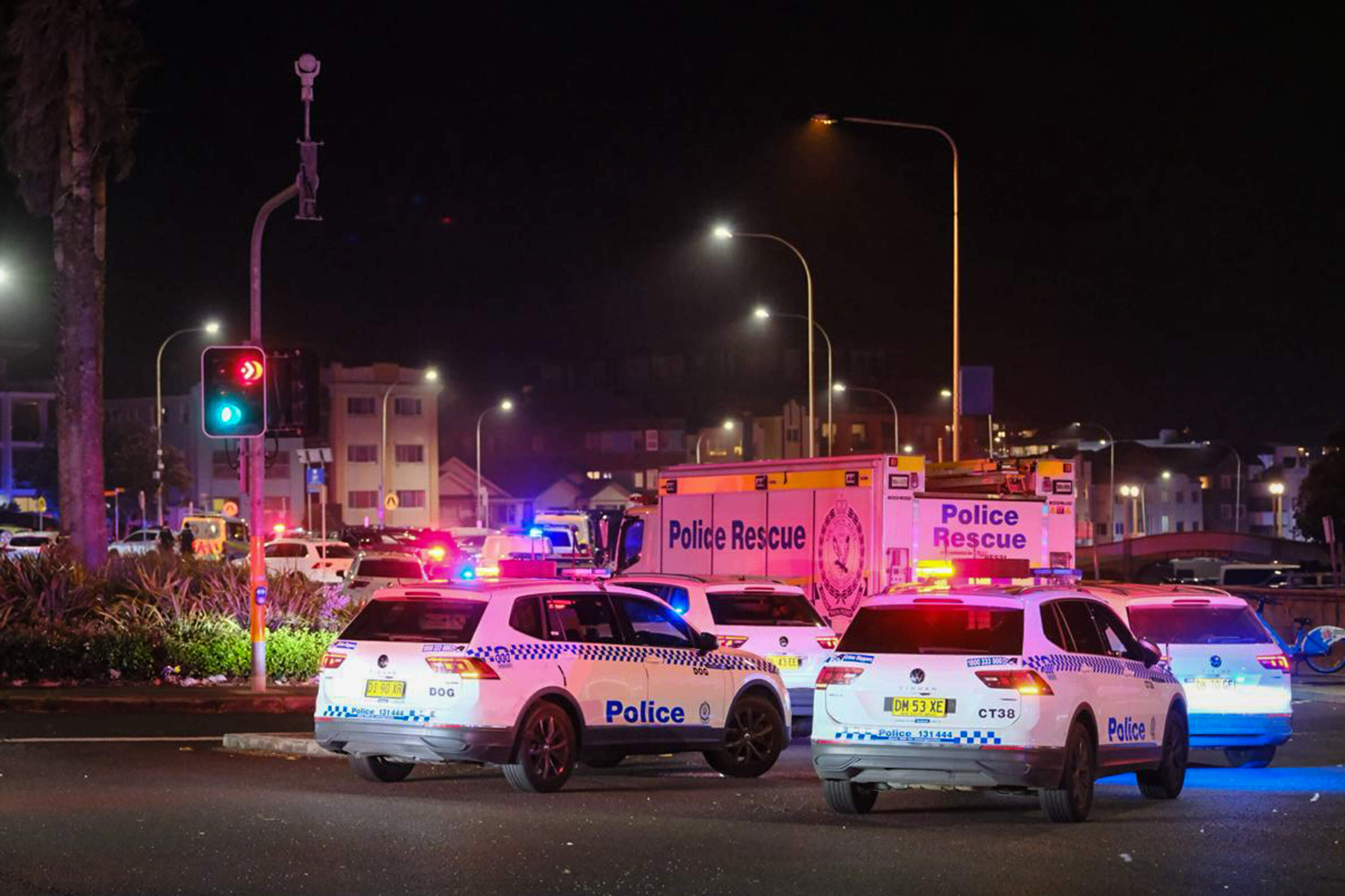 Police cars are seen parked at at the scene of a mass shooting at Bondi Beach on December 14, 2025 in Sydney, Australia. (George Chan/Getty Images)