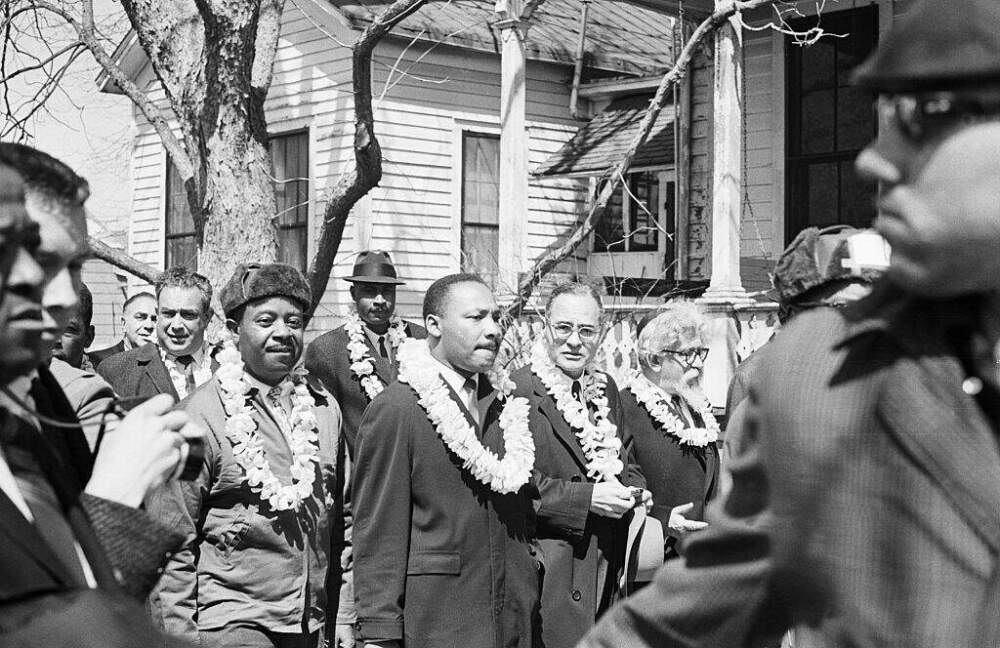 Civil rights leaders Ralph Abernathy, Martin Luther King Jr., former UN Ambassador Ralph Bunche, and Rabbi Abraham Joshua Heschel (l-r) wear leis during the start of a march from Selma to Montgomery, Alabama. (Bettman/Getty Images)