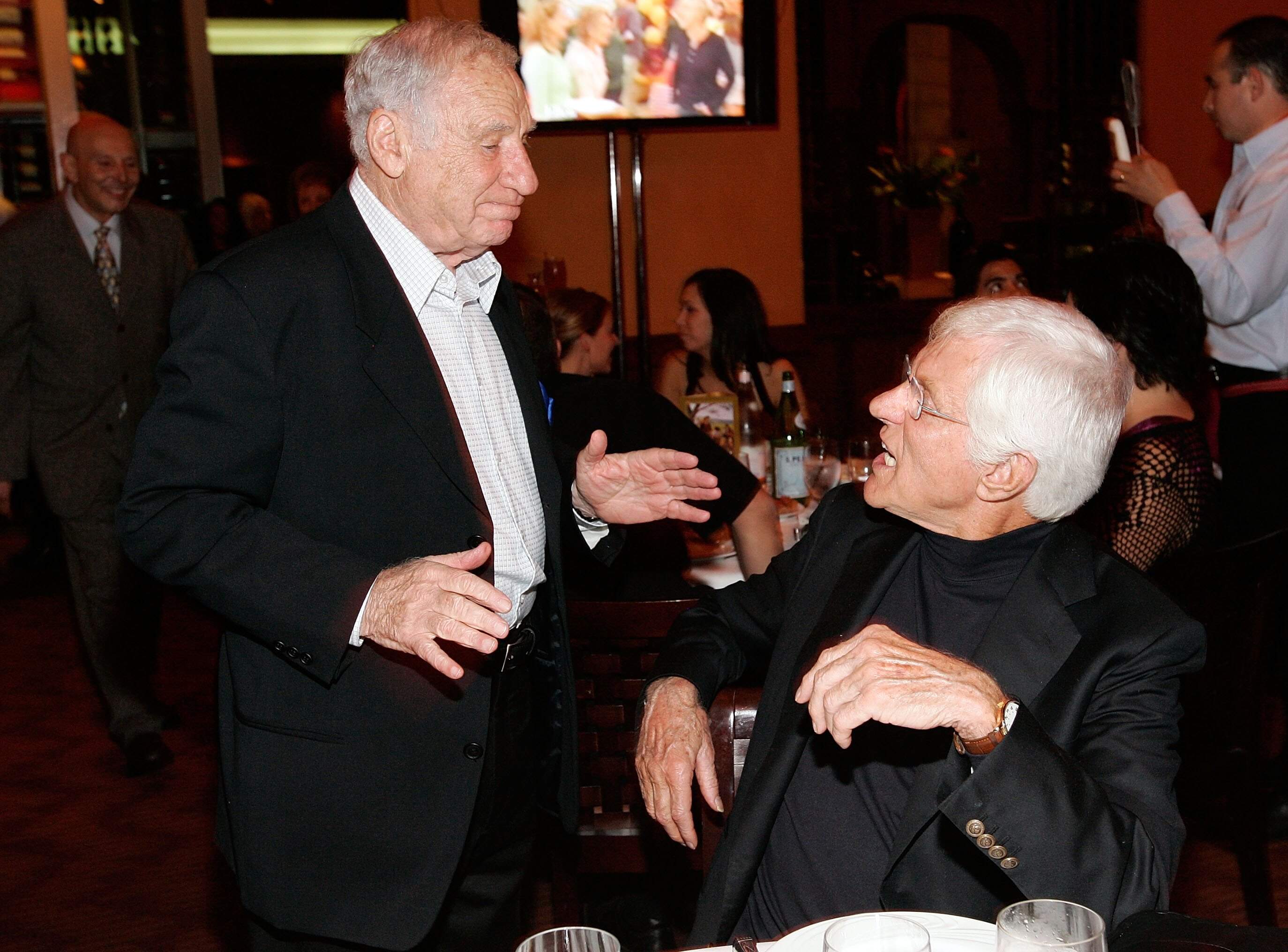 Actor/Director/Producer Mel Brooks (L) and Actor Dick Van Dyke talk at the celebration for Cloris Leachman's 60 years in show business at Fogo De Chao restaurant on Oct. 5, 2006 in Beverly Hills, California. (Vince Bucci/Getty Images)