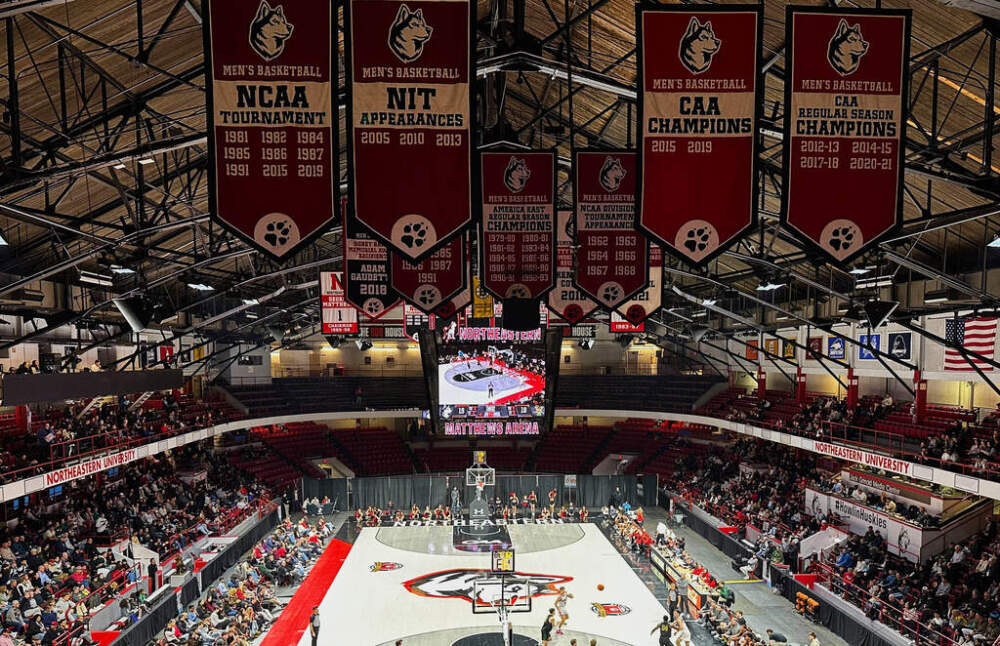 College championship flags hang over the court at Northeastern University's Matthews Arena. (Jimmy Golen/AP)