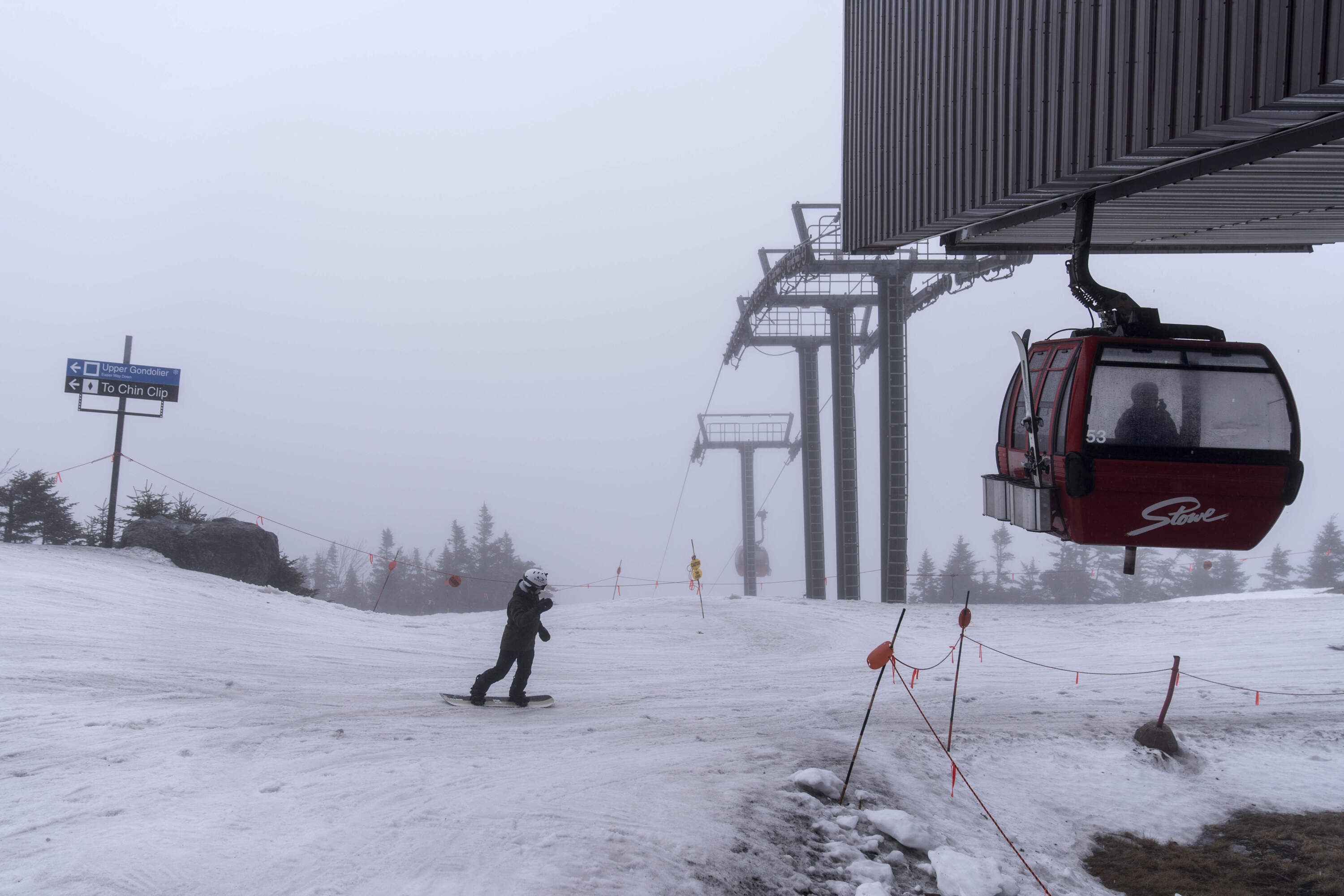 A snowboarder descends from the summit at Stowe Mountain Resort, Wednesday, March 6, 2024, in Stowe, Vt. (David Goldman/AP)