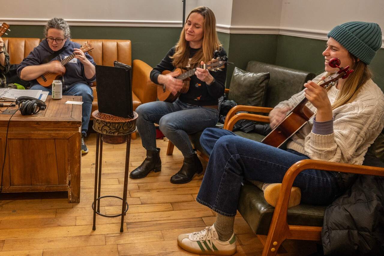 Ukulele players at a meetup of the Strummerville Ukulele Club in Somerville (Sharon Brody/WBUR)