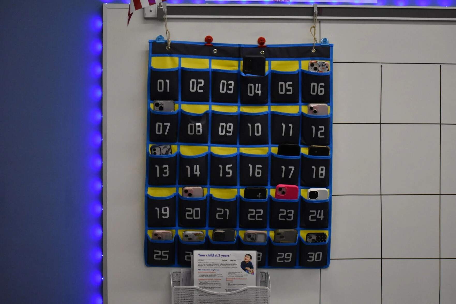 Students at Attleboro High School have been required since 2024 to give up their cellphones during academic time. The phones stay in a pouch while students are in class, and they have access to the devices during lunch breaks, before and after school and between classes. (SHNS)