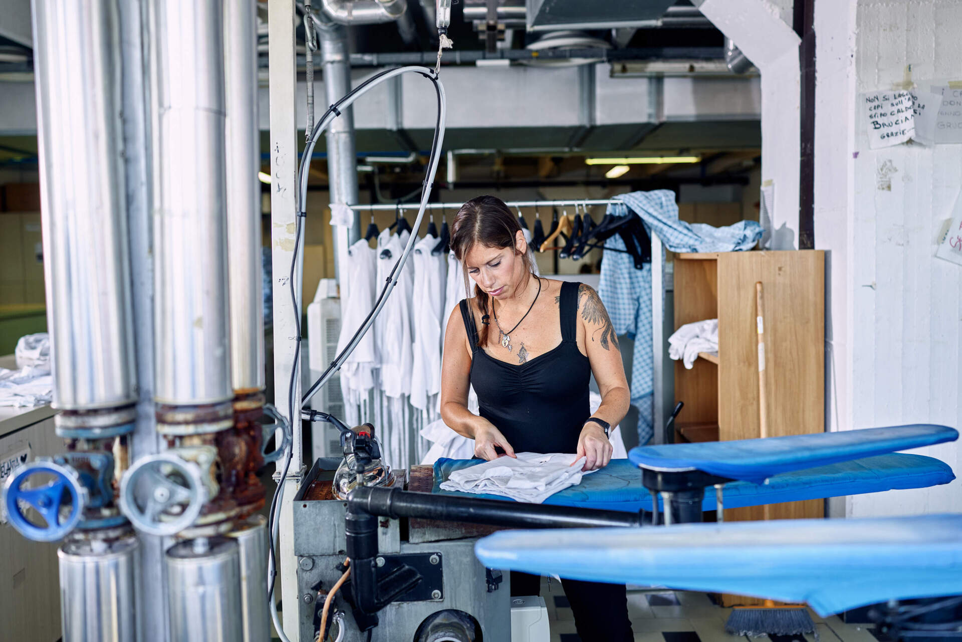 A woman works in the laundry at San Patrignano. (Wilson Santinelli for WBUR)
