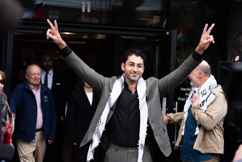 Mohsen Mahdawi greets supporters outside the federal courthouse in Burlington, Vt. after a judge ordered his release from detention on April 30, 2025. The Trump administration detained Mahdawi, a green-card holder, at a citizenship appointment in Vermont earlier that month. (Joey Palumbo/Vermont Public)