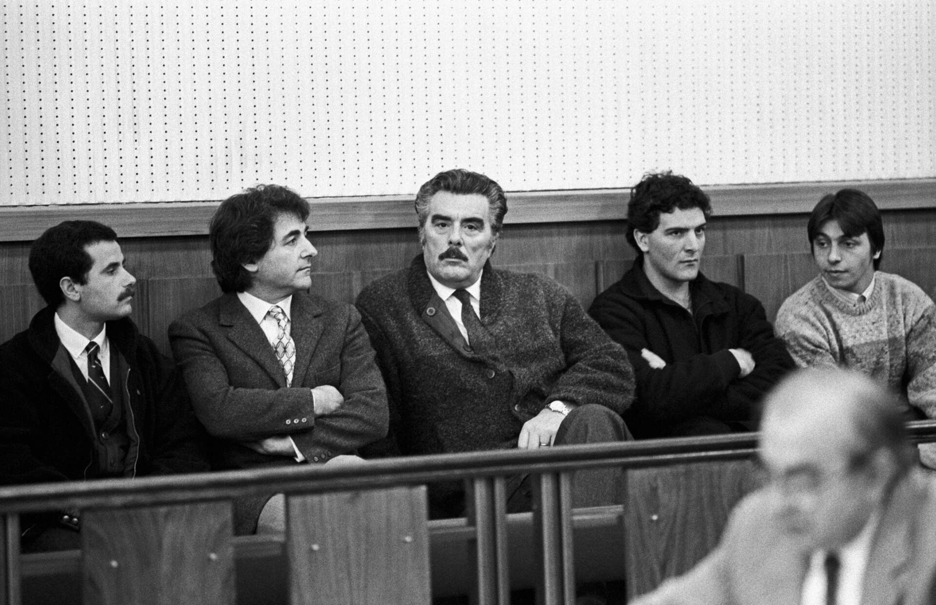 Vincenzo Muccioli, center, in an Italian courtroom in the 1980s. Years later, Muccioli would be convicted of playing a role in covering up the murder of a San Patrignano resident. (Nino Leto/Mondadori via Getty Images)