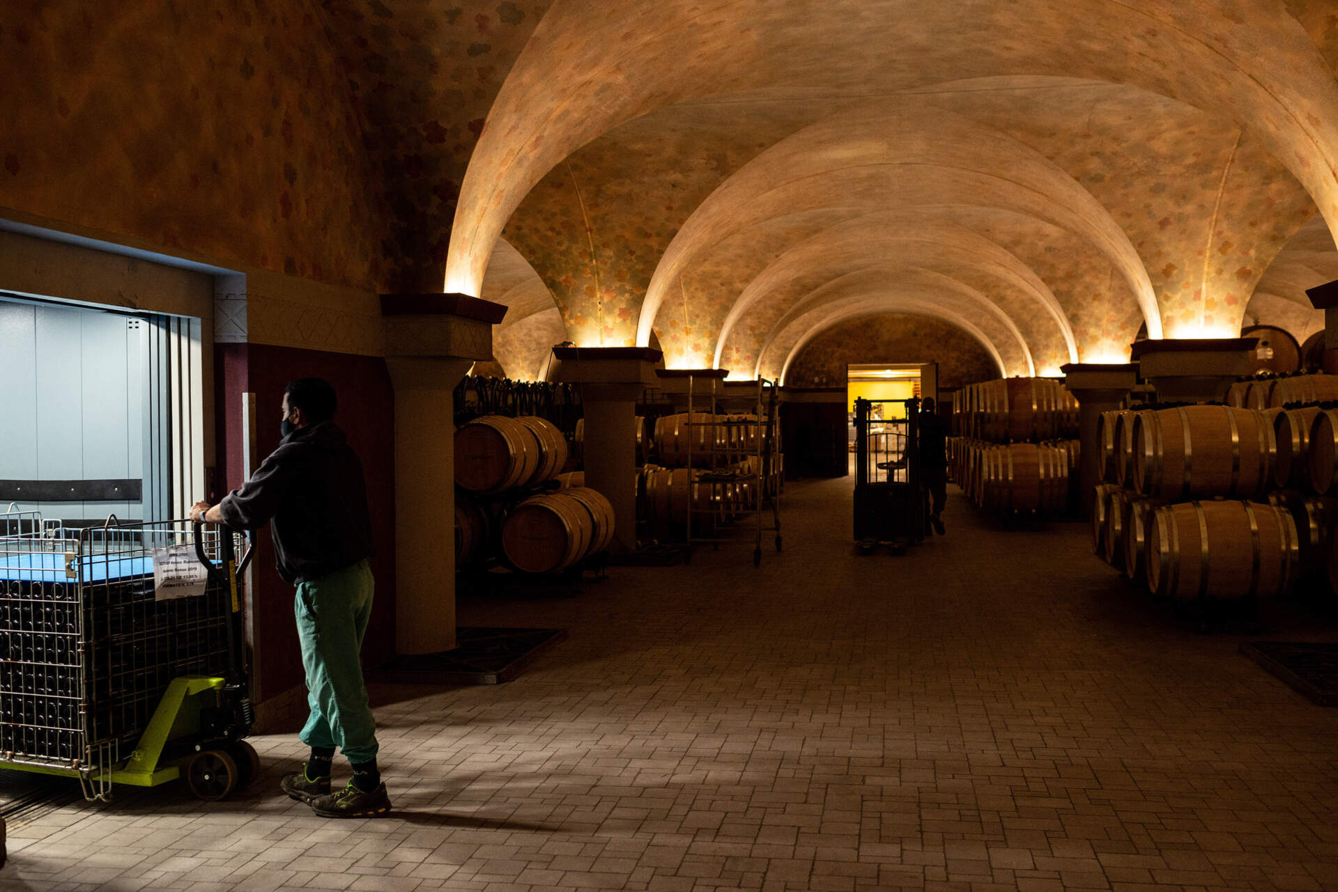 Men working at San Patrignano's winery in 2021. The rehab sells about 400,000 bottles of wine every year. (Elisabetta Zavoli/Getty Images)