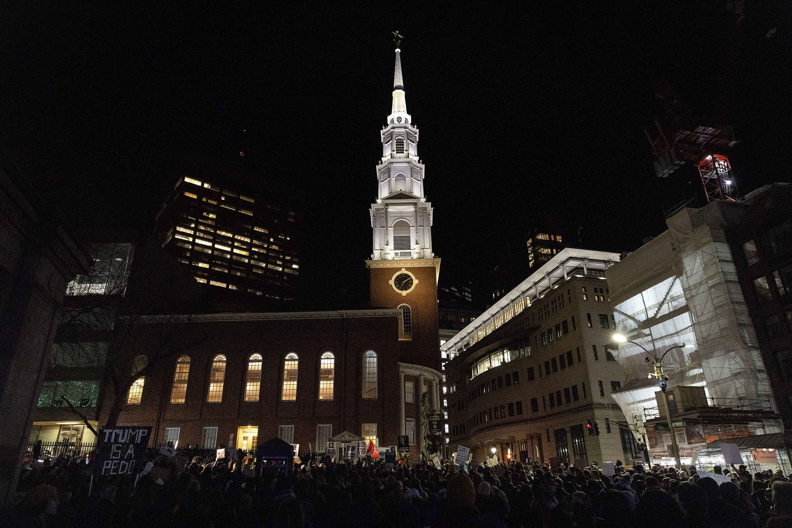 Protesters against ICE, demanding justice for Renee Nicole Good, who was killed by ICE in Minneapolis, end their march across downtown Boston at City Hall Plaza. (Robin Lubbock/WBUR)