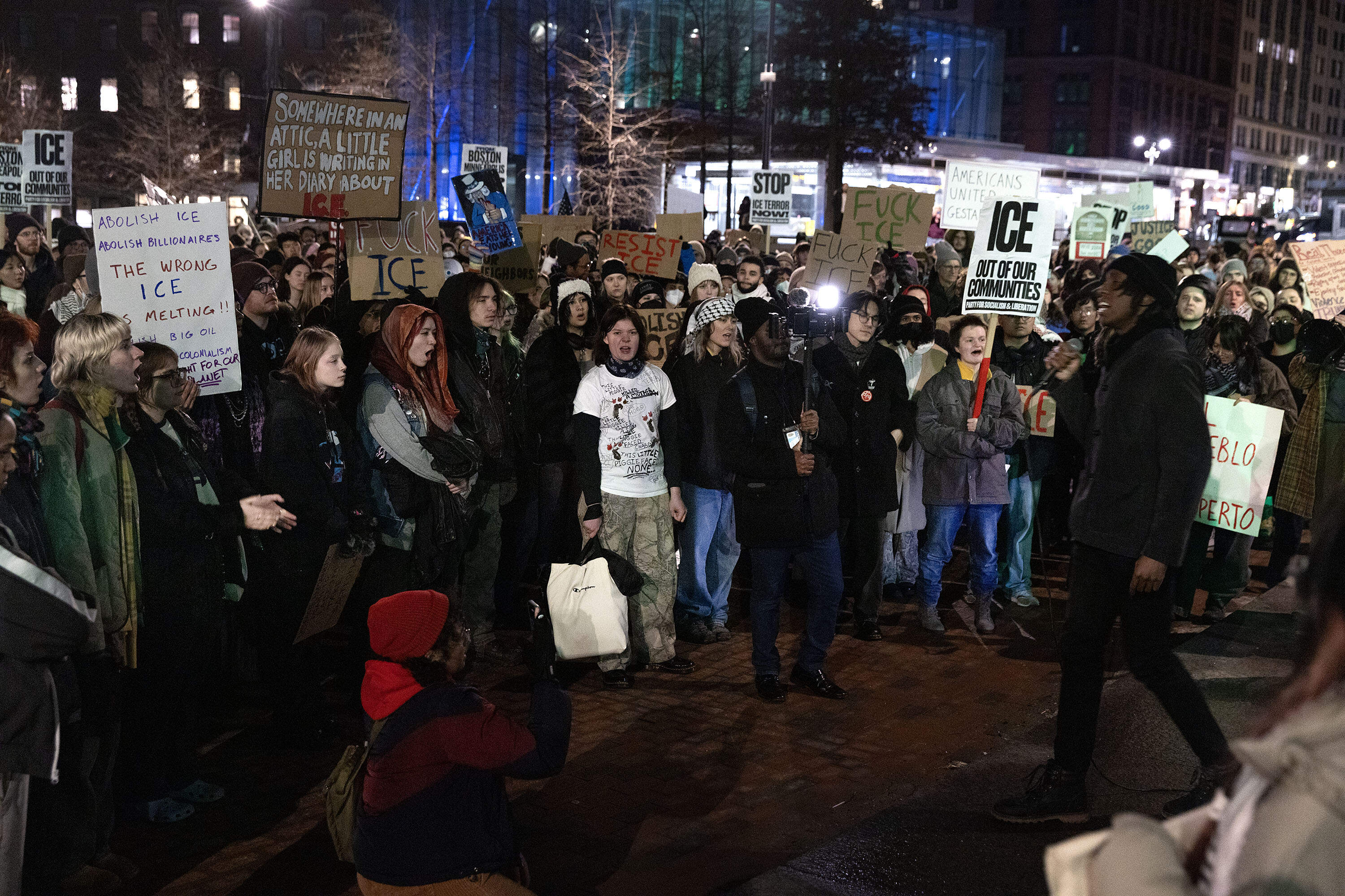 Protesters against ICE, demanding justice for Renee Nicole Good, who was killed by ICE in Minneapolis, end their march across downtown Boston at City Hall Plaza. (Robin Lubbock/WBUR)
