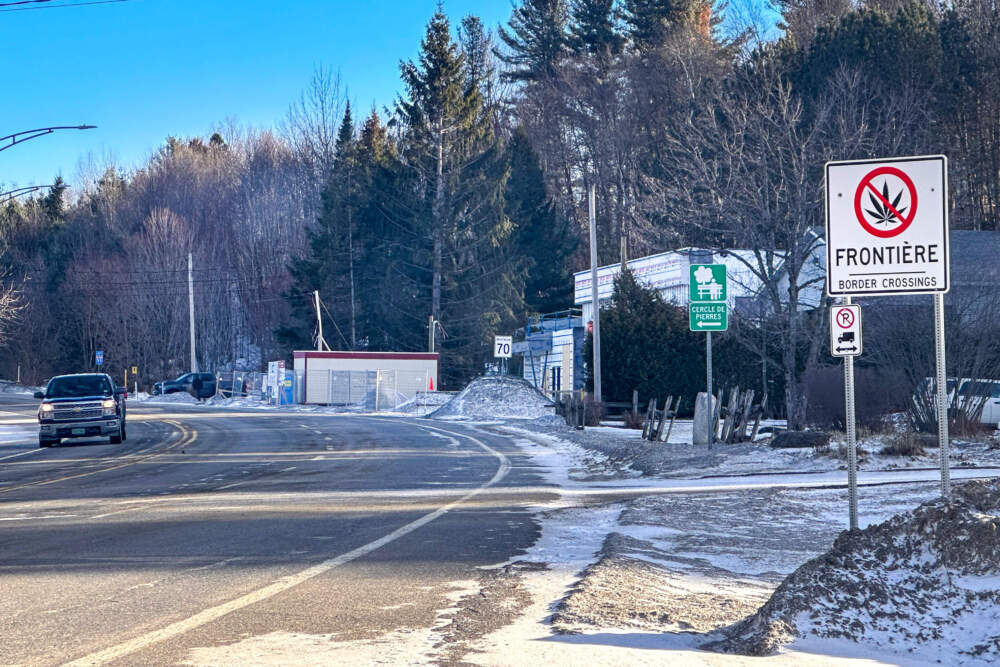 Road signs in Stanstead, Quebec, inform travelers of an upcoming border crossing. (Simón Rios/WBUR)