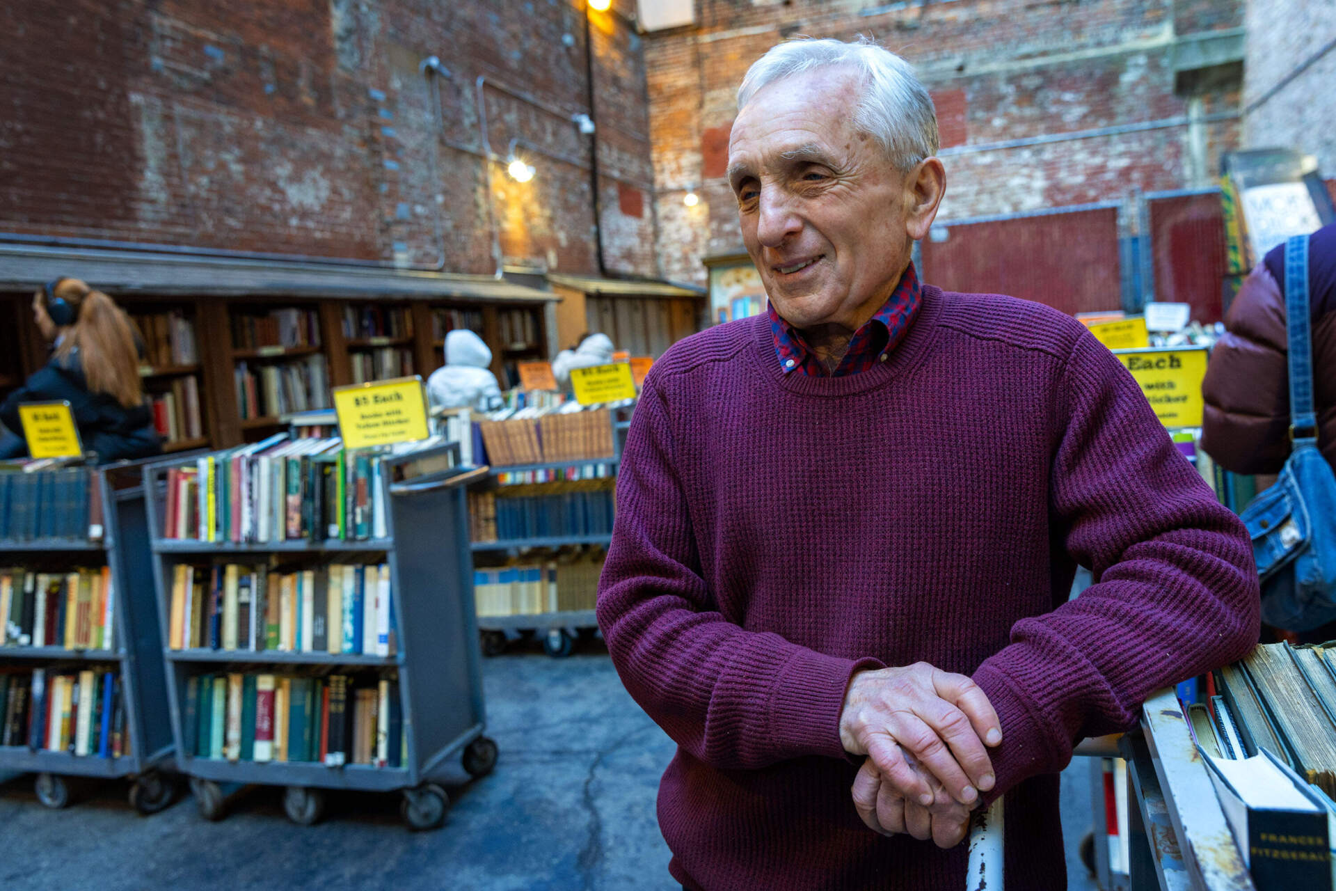 Brattle Book Shop owner Ken Gloss in the bookstore's outdoor book browsing section. (Robin Lubbock/WBUR)
