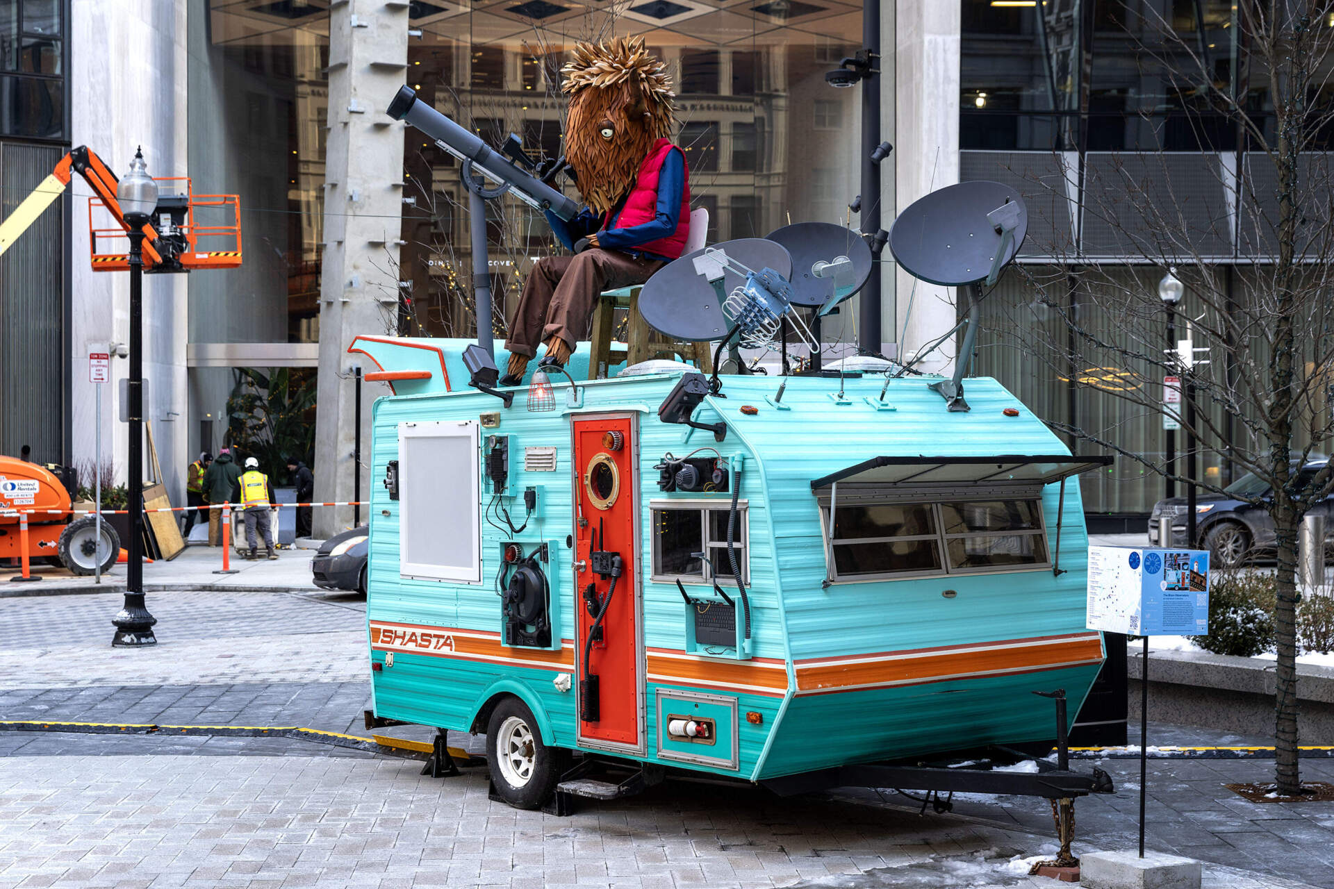 An observer bison sits on top of "The Bison Observatory" by Individuals Collective, part of this year's downtown Boston walkable art experience Winteractive. (Robin Lubbock/WBUR)