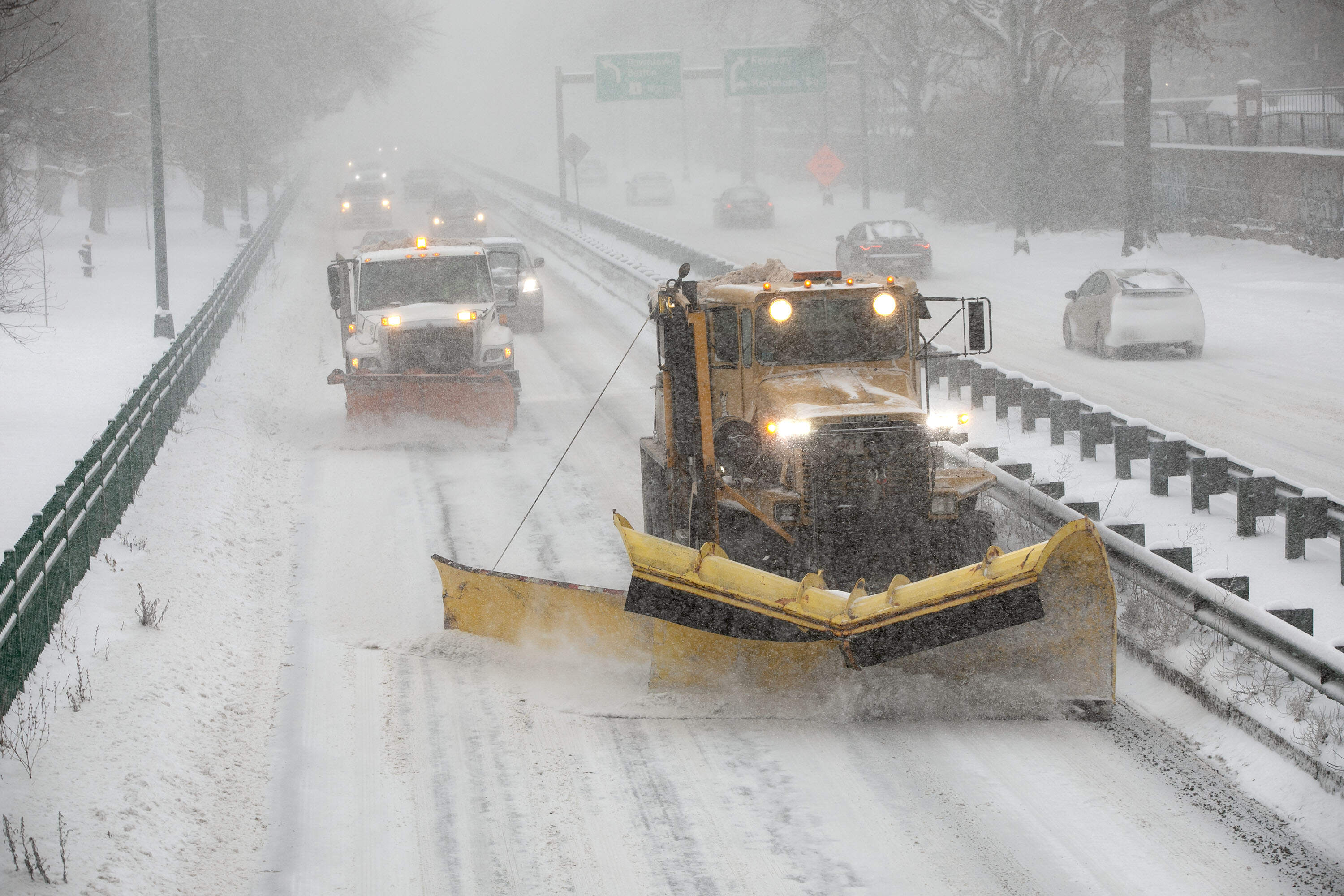 Snowplows clear snow from Storrow Drive on Sunday during Boston's first major snowstorm of 2026. (Robin Lubbock/WBUR)