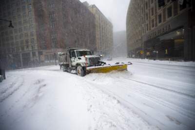 Mass. officials urge residents to stay off the roads; Boston and others close schools Monday