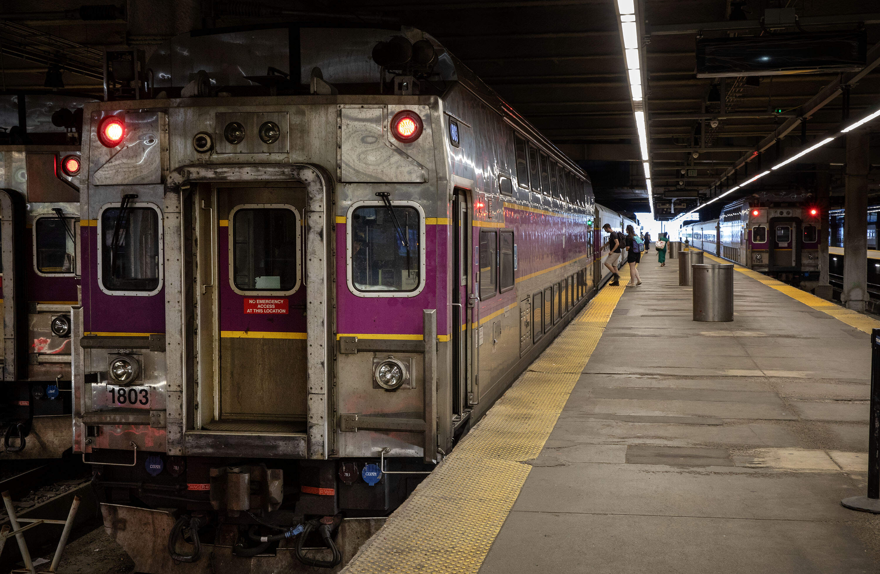 Passengers board a commuter rail train at Boston's South Station. (Robin Lubbock/WBUR)