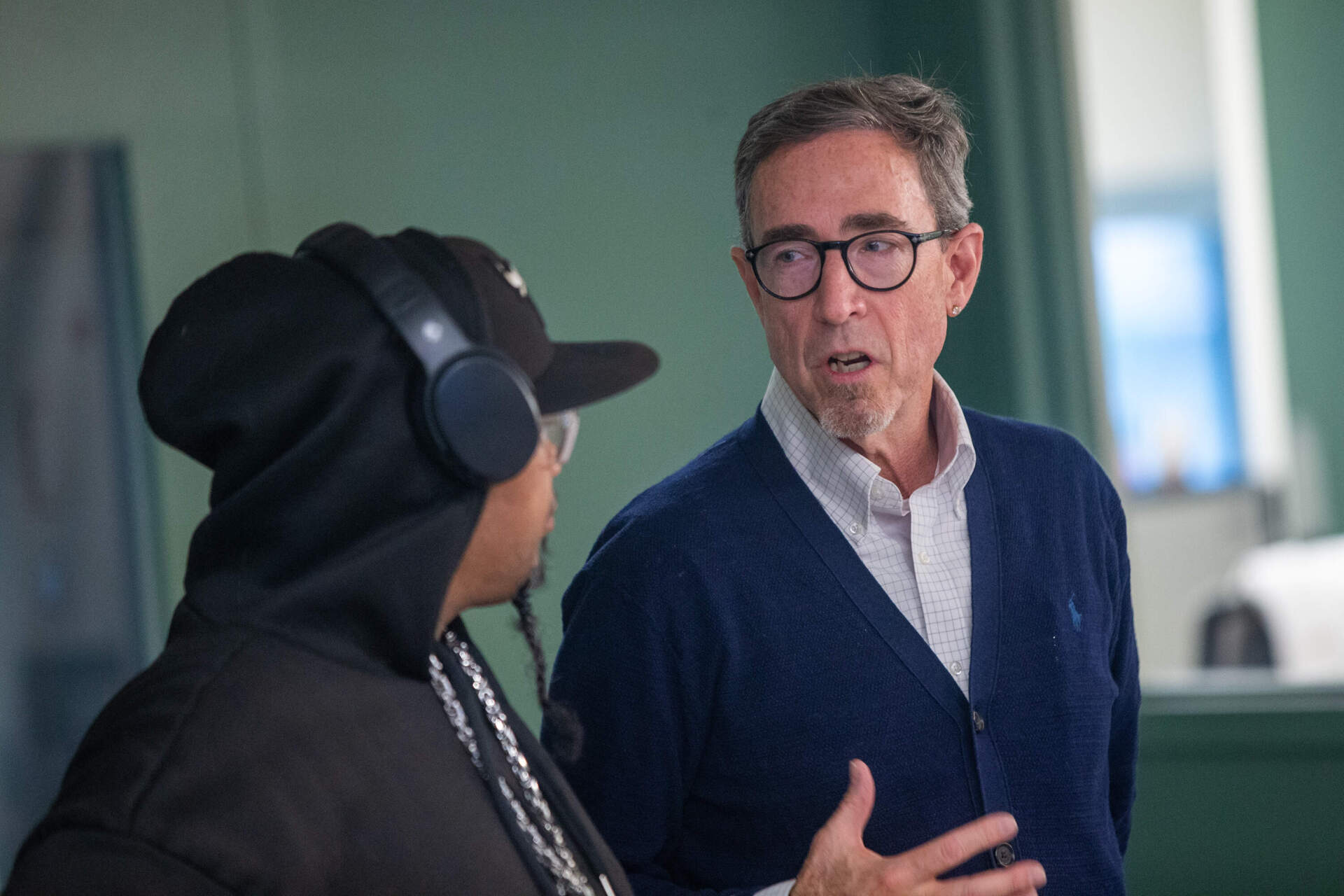 Project manager Phil Renzi talks with St. Francis House guest Henry Blocker. (Jesse Costa/WBUR)
