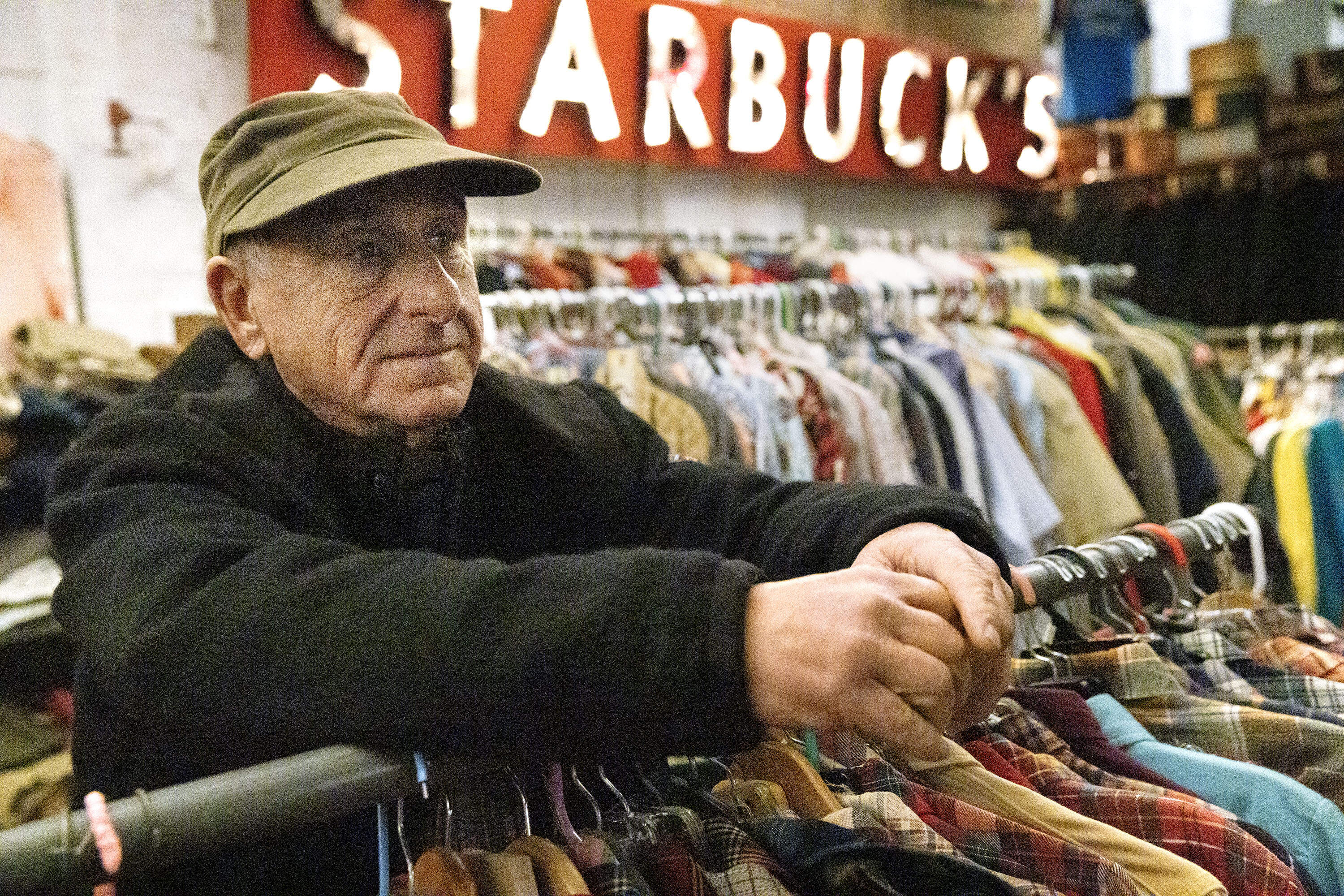 Richard Viens surveys the the collection. (Robin Lubbock/WBUR)
