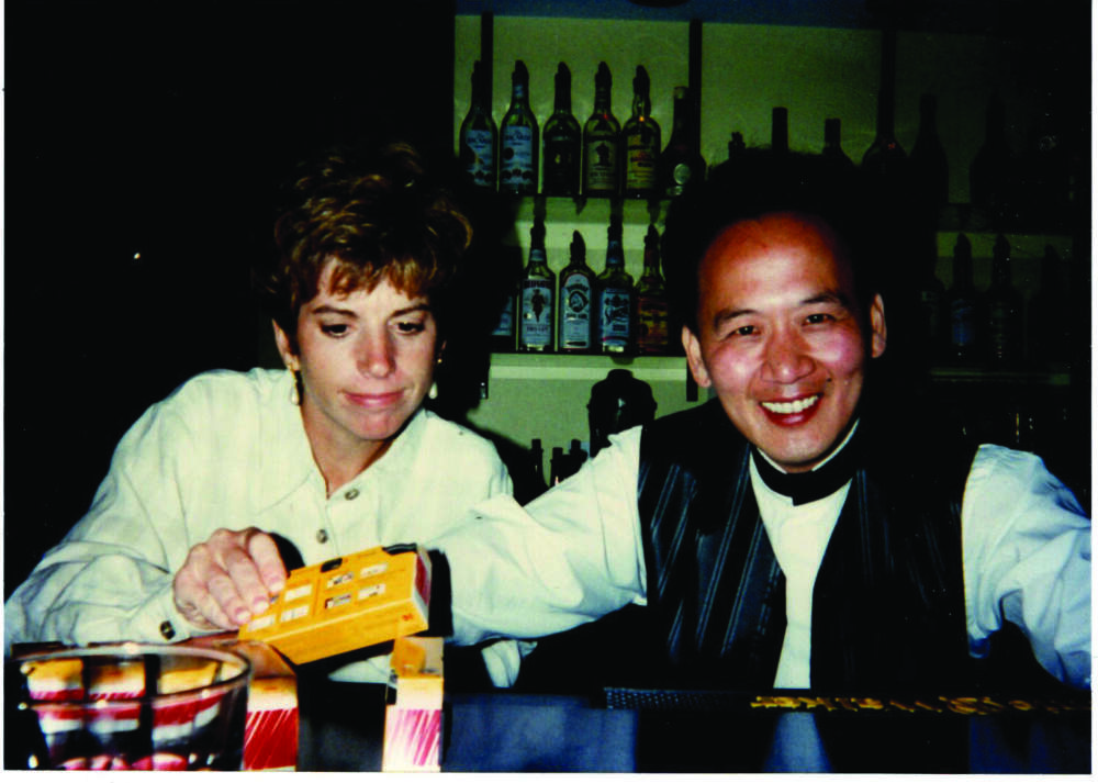 The author and her now-husband James behind the bar at Beijing House in 1996. (Courtesy Pegasus Books)