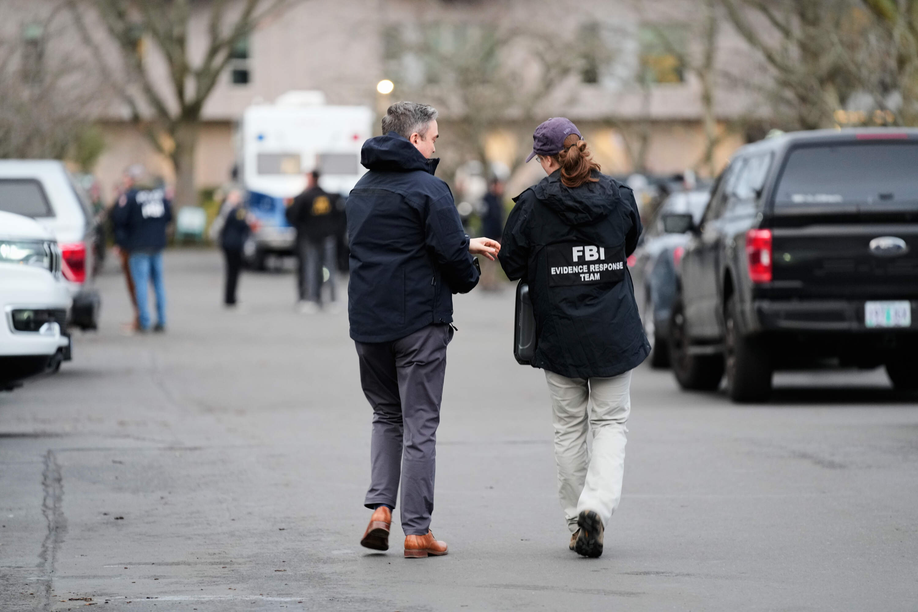 Law enforcement officials work the scene following reports that federal immigration officers shot and wounded people in Portland, Ore., Thursday, Jan. 8, 2026. (Jenny Kane/AP)