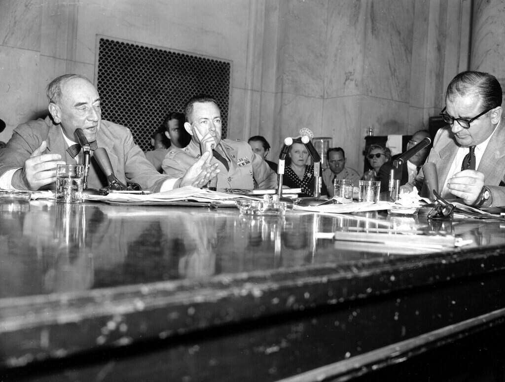 Special army counsel Joseph Welch, left, lashes Sen Joseph McCarthy (R-Wisc.), right, as a "reckless and cruel" man after McCarthy threw a charge of Communist association at a member of Welch's law firm, June 9, 1954. "If there is a God in heaven," Welch said, "it will do neither you nor your cause any further good." (AP Photo)