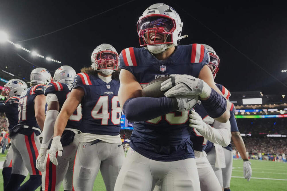 New England Patriots linebacker Christian Elliss celebrates after recovering a fumble by Los Angeles Chargers quarterback Justin Herbert in a wild-card playoff football game Sunday, Jan. 11, 2026. (Charles Krupa/AP)