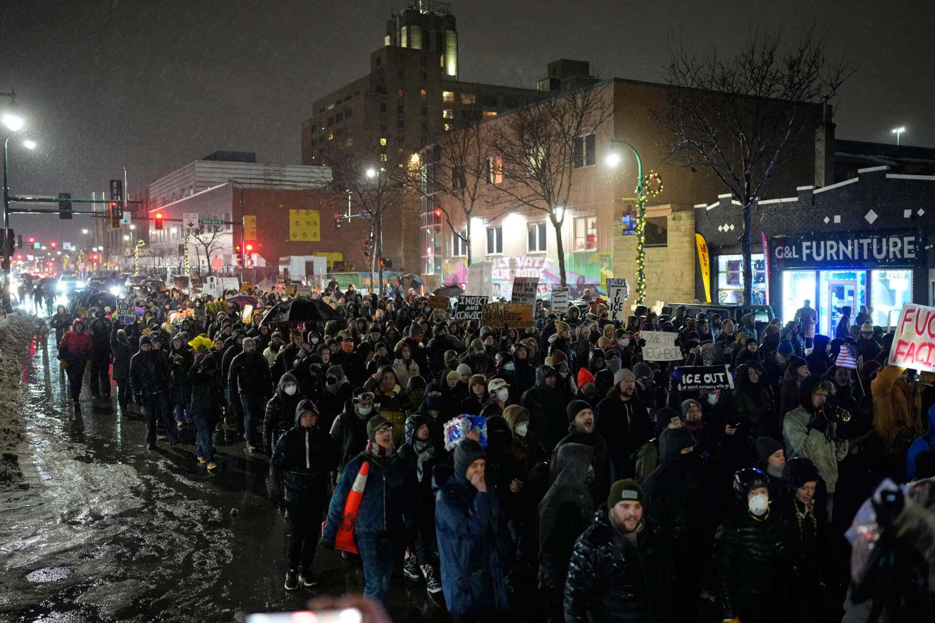 Protesters chant and march during a rally Thursday night for Renee Good, who was fatally shot by an ICE officer, in Minneapolis. (John Locher/AP)