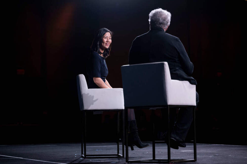 Boston Mayor Michelle Wu talks with Carole Wedge during the 94th Winter Meeting of the U.S. Conference of Mayors on Wednesday. (Kevin Wolf/AP)