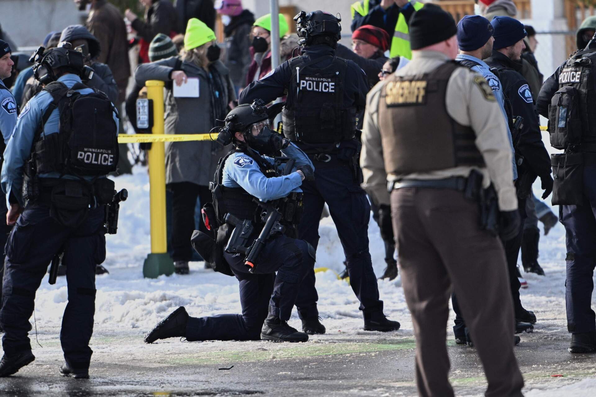 Federal law enforcement officers at scene of the shooting in Minneapolis on Jan. 7. (Tom Baker/AP)