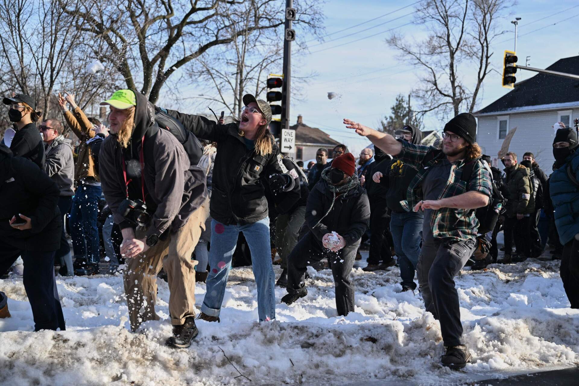 People protest at the scene of the shooting on Wednesday in Minneapolis. (Tom Baker/AP)